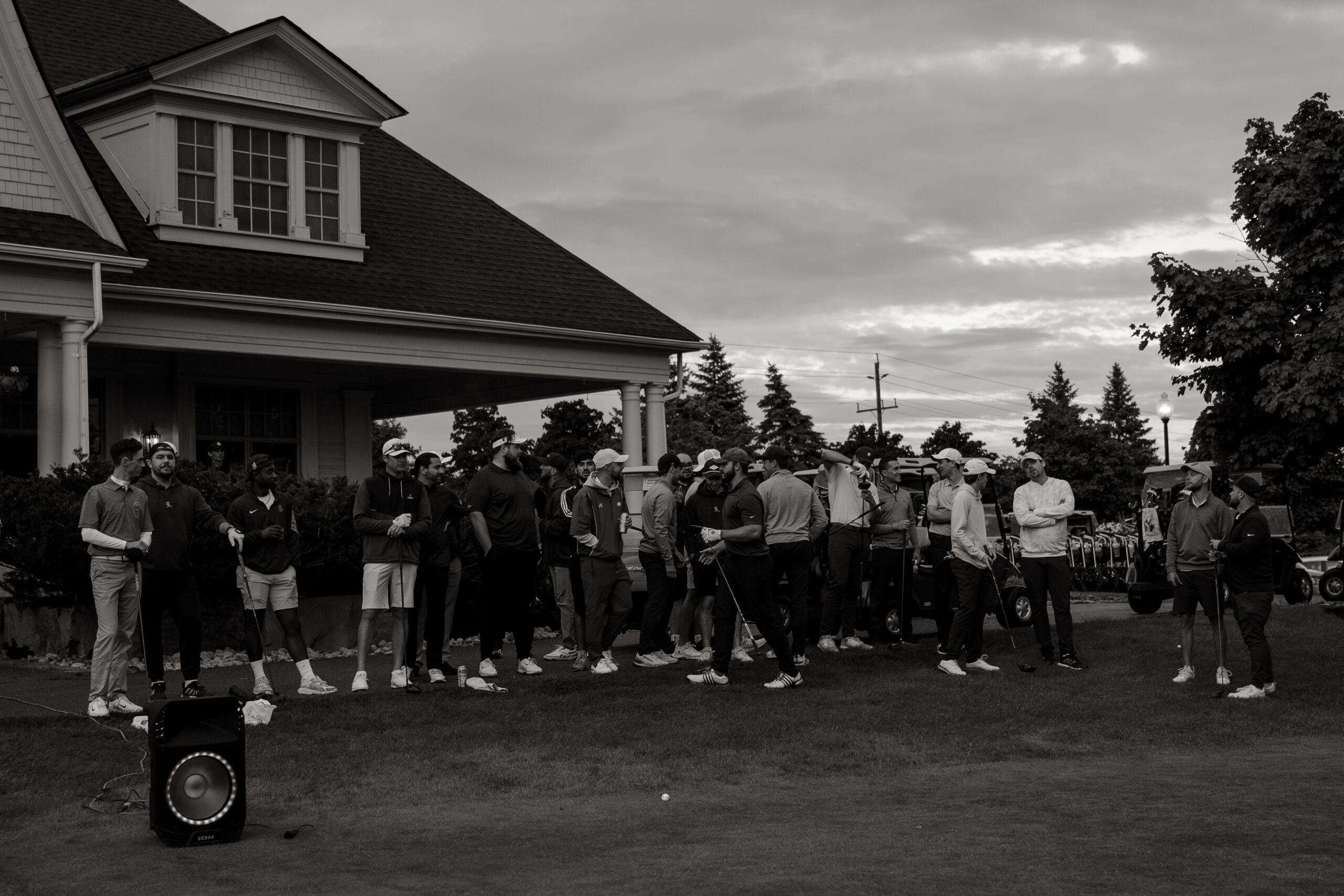 A large group of golfers laughing at The Links Social Tour during the long drive competition